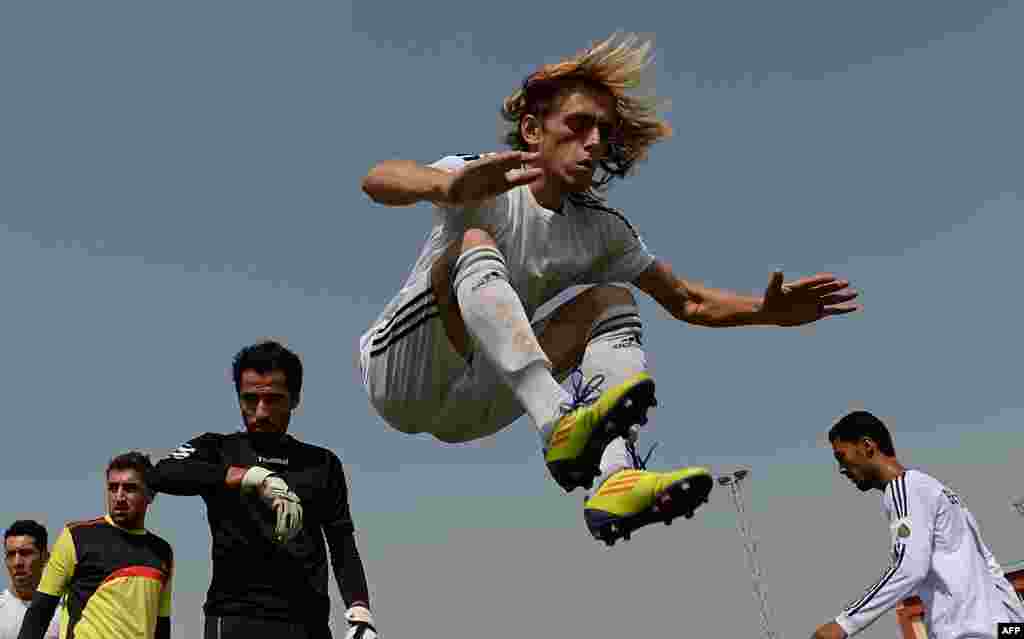 Afghan soccer players at a training session at a Kabul stadium on September 2.