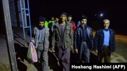 Afghan returnees arrive at an International Organization for Migration (IOM) transit center after returning from Iran, in Herat, in January 2018.