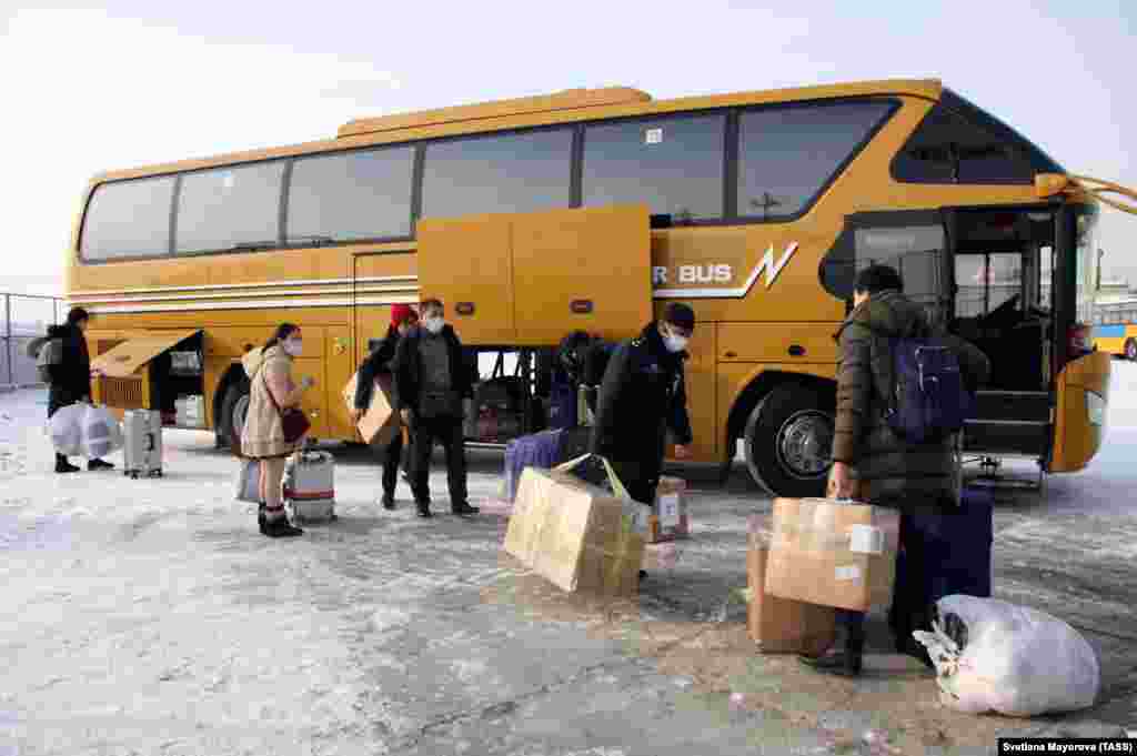RUSSIA -- BLAGOVESHCHENSK, RUSSIA - FEBRUARY 1, 2020: Chinese citizens passing through a temporary corridor opened at a border checkpoint between Blagoveshchensk and Heihe. T