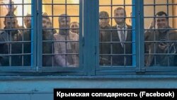 Крымские адвокаты со своим подзащитными крымскими татарами, задержанными после пикета под зданием Верховного суда России, в отделении полиции. Москва, 12 июля 2019 года