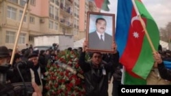 Mourners for Zaur Hasanov at a funeral procession on December 29.