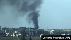 Smoke billows from a target in Tel Abyad during bombardment by Turkish forces on October 11.