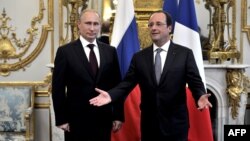 Russian President Vladimir Putin (left) met with French President Francois Hollande ahead of D-Day's 70th anniversary on June 6.