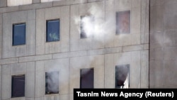 Smoke is seen during an attack on the Iranian parliament in central Tehran, Iran, June 7, 2017.