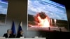 Almaz-Antey spokesman Valery Yarmolenko (left) and Almaz Antey's general director Yan Novikov showed dramatic video from an experiment in which the weapons manufacturer blew up an airliner in what it said was an attempt to gauge blast trajectories.