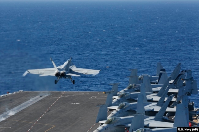 The Pentagon on May 10 said the USS Arlington amphibious assault ship will join the USS Abraham Lincoln Carrier Strike Group (above) and a B-52 bomber task force already headed toward the Persian Gulf. (file photo)