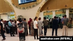 People waiting for a ticket at Ashgabat's airport in August, where there are many reports of officials refusing to let people leave.