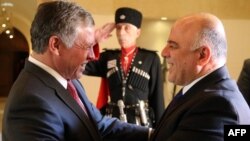 العاهل الأردني الملك عبدالله الثاني يرحب برئيس الوزراء العراقي حيدر العبادي في عمّان