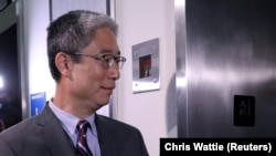 Former associate U.S. deputy attorney general Bruce Ohr enters an elevator after testifying behind closed doors before two Republican-led congressional committees on August 28.