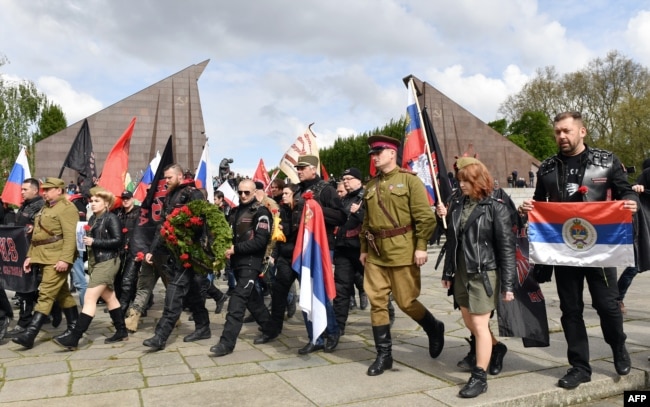 Night Wolves members and sympathizers take part in a provocative event commemorating Victory Day in World War II at a Soviet monument in Berlin in May 2017.