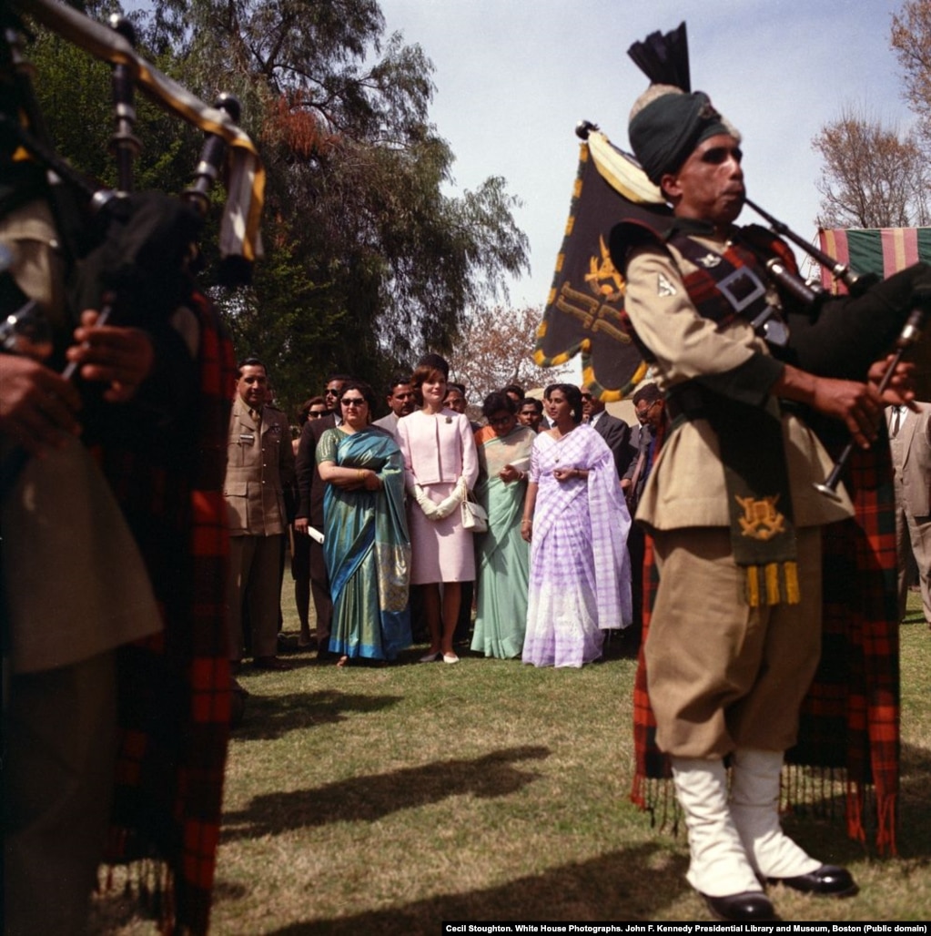 Jacqueline Kennedy listens to a performance of bagpipers at the Khyber Rifles officers’ mess in Khyber Pakhtunkhwa, in northwestern Pakistan.