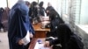Afghan women cast their vote during the parliamentary elections in Kandahar late last year. 
