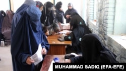 Afghan women cast their vote during the parliamentary elections in Kandahar late last year. 