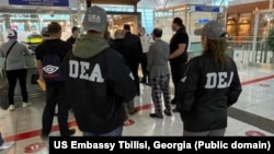 Mohamad Yassine and Hassan Abdul Rahman are handed over to U.S. DEA agents in Tbilisi airport on May 2.