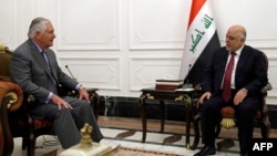 US Secretary of State Rex Tillerson (left) meets with Iraqi Prime Minister Haidar al-Abadi in Baghdad on October 23.