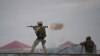 An Afghan Quick Reaction Force (QRF) soldier fires a rocket-propelled grenade (RPG) launcher during an operation near the Indian consulate in Mazar-e Sharif on January 4, 2016