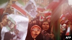 Supporters of Iranian President Mahmud Ahmadinejad celebrate his victory in Tehran on June 14.