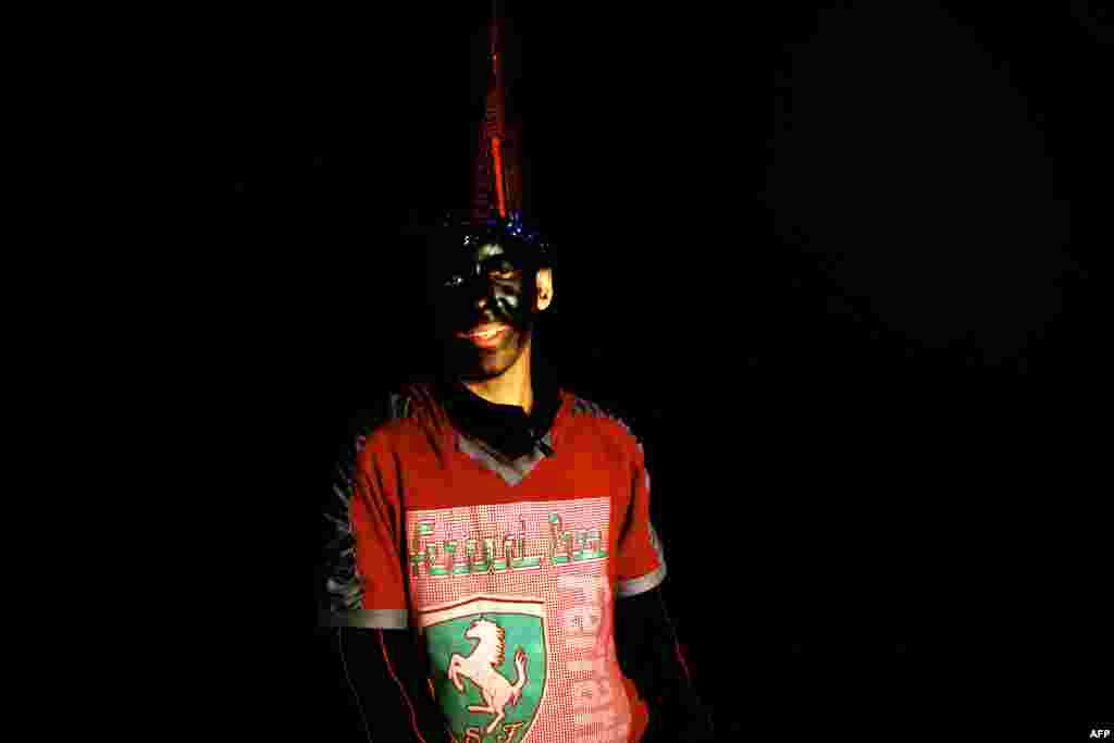 Sajjad, age 14, plays Haji Firuz with his face smeared with soot. The custom is thought to be related to ancient Zoroastrian fire rituals, in which a designated fire-keeper played a central role.