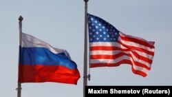 RUSSIA -- FILE PHOTO: National flags of Russia and the U.S. fly at Vnukovo International Airport in Moscow, Russia April 11, 2017. 