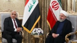 Iraqi Prime Minister Adil Abdul-Mahdi (left) meets with Iranian President Hassan Rohani in July.