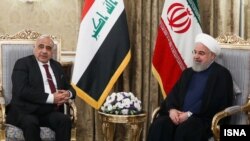Iraqi Prime Minister Adil Abdul-Mahdi with Iranian President Hassan Rohani in July