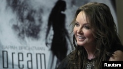 British entertainer Sarah Brightman smiles during an interview in Moscow on October 10, when she announced her plans to travel to the International Space Station aboard a Soyuz spacecraft.
