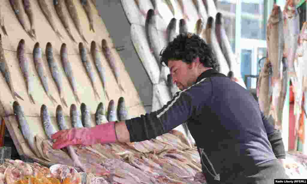 A fish seller at a market in the Afghan capital, Kabul