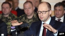 Ukrainian Prime Minister Arseniy Yatsenyuk speaks during a meeting with leaders and representatives of the industrial elite of the region in the eastern city of Donetsk on April 11.