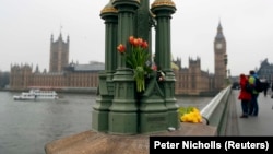 Floral tributes are seen on Westminster Bridge following the attack.