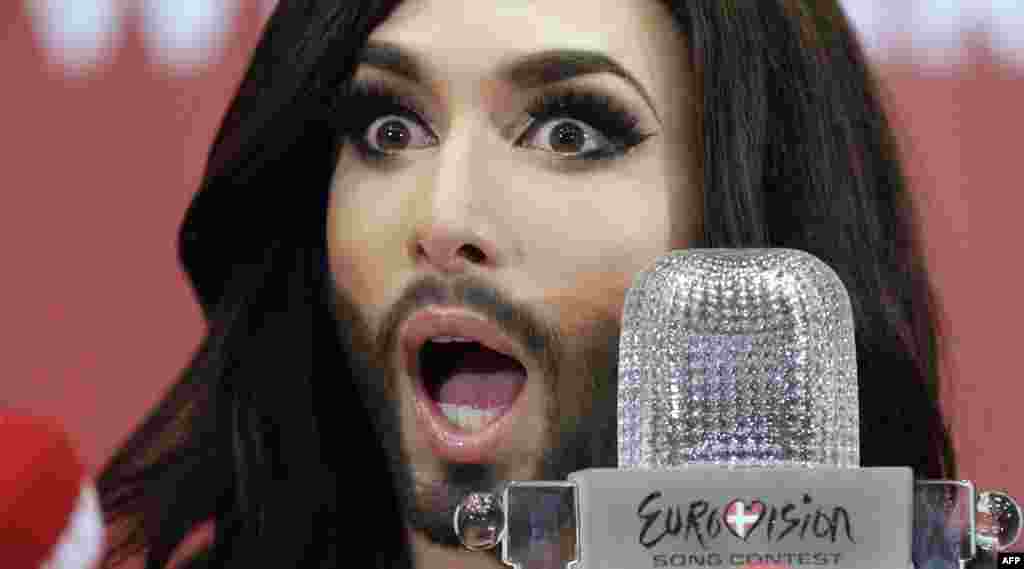 Transvestite singer Conchita Wurst speaks to the press in Vienna on May 11, one day after winning the Eurovision Song Contest as Austria&#39;s contestant. (Georg Hochmuth, AFP)