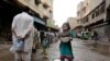 People line in the eastern Pakistani city of Lahore to receive free food before the time to break the Ramadan fast on May 3.