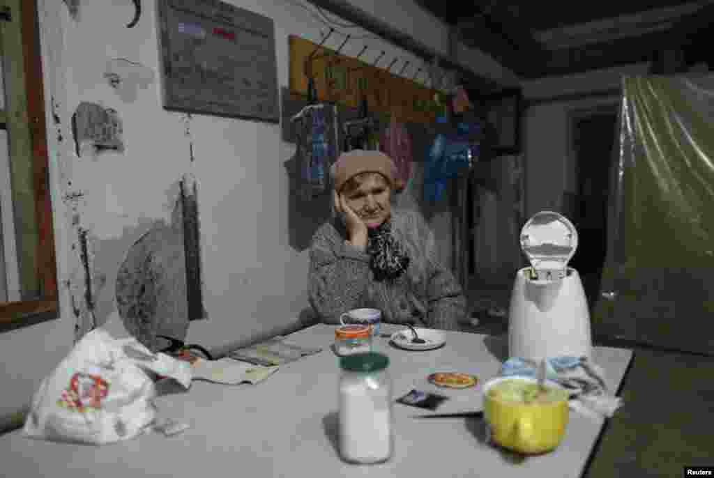 An internally displaced woman waits out the fighting in a shelter in Donetsk, Ukraine. (Reuters/Antonio Bronic)