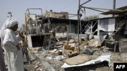 The site of a bomb blast in the Shi'ite neighbourhood of Sadr City in north Baghdad on July 28