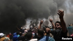 A Palestinian demonstrator reacts during a protest on May 14 against the U.S. Embassy's move to Jerusalem.