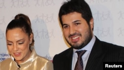 Turkish singer Ebru Gundes with her husband, businessman Reza Zarrab (right), before his arrest