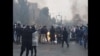 No images show any armed protesters during November unrest in Iran. Amnesty International says at least 304 protesters were killed by the government.