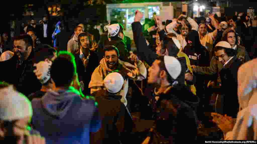 Young people dancing the fiery Jewish songs in modern processing.