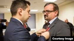RFE/RL’s Minsk Bureau Chief Web Editor with the Belarus Service Valery Kalinovsky receiving the Bene Merito medal at the Polish embassy in Minsk November 17, 2016.
