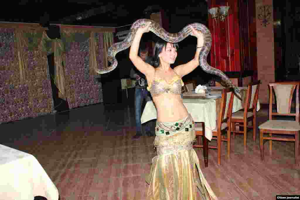 A snake dance in the southern city of Taraz. Kazakhstan has snakes, but not this big.