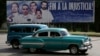 Плакат на Кубе, призывающий освободить кубинцев, содержащихся в тюрьме США 