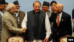Indian Prime Minister Narendra Modi, left, Pakistani Prime Minister Nawaz Sharif, center, and Afghan President Ashraf Ghani shake hands at a closing session of the 18th SAARC summit in Kathmandu in 2014.