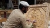 Nuristani woodcarving is now extended to making emblems and other contemporary artifacts for profit.