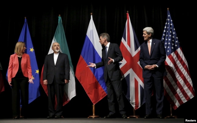 Top diplomats of JCPOA parties prepare for a group photo after clinching a landmark nuclear deal in Vienna on July 14, 2015.