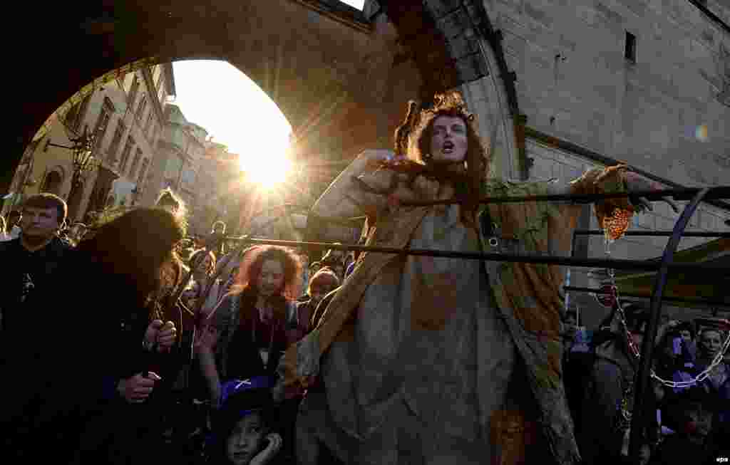 A woman dressed as a witch takes part in a parade during annual Walpurgis Night celebrations in central Prague on April 30. (epa/Filip Singer)