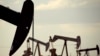 FILE - In this April 24, 2015 file photo, pumpjacks work in a field near Lovington, N.M. 