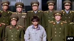 North Korean leader Kim Jong-Il (front row, center) with Ministry of People's Security officials at an undisclosed location