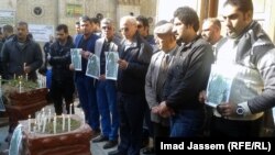 Iraqis mourn Muhannad Muhammad, a journalist killed in an explosion in Baghdad in December.