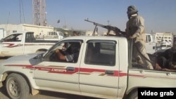 A screen grab from video distributed by insurgents of the Islamic State as they took over military barracks in Tikrit, Iraq.