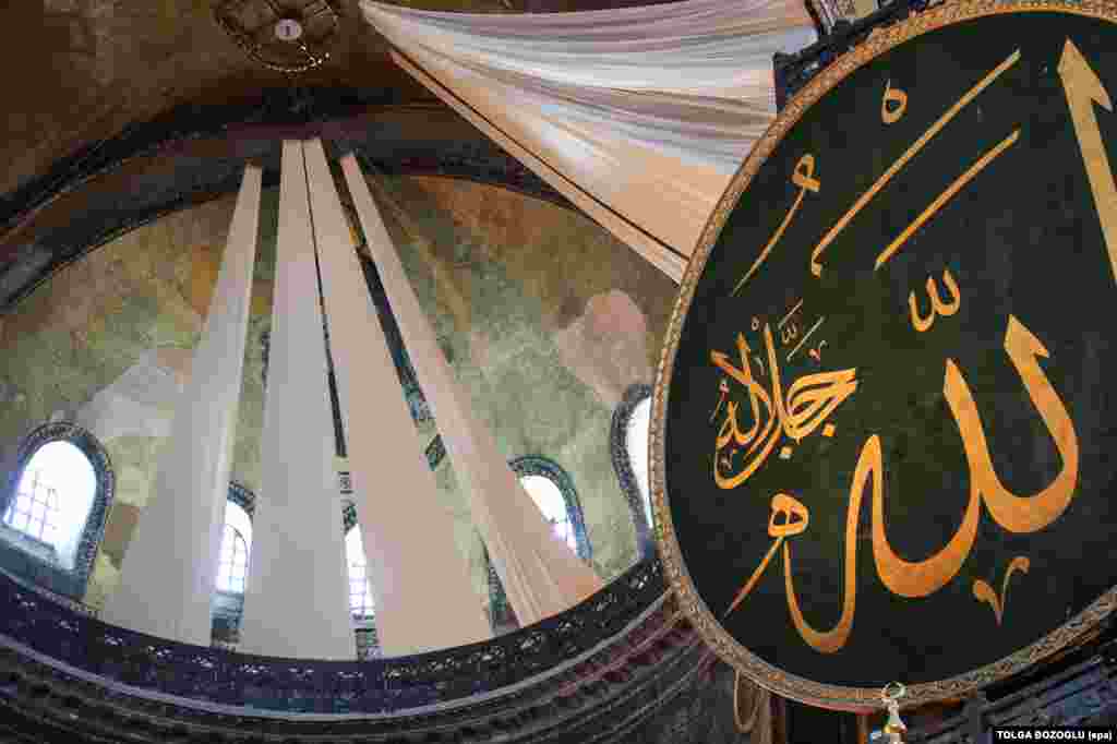 Curtains seen covering an ancient Christian fresco on July 24. It is not yet clear whether the curtains will be removed when prayers are not underway. 