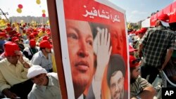 File photo:Hezbollah leader Sheik Hassan Nasrallah and Venezuela's President Hugo Chavez, top, during a Hezbollah "victory over Israel" rally, in Beirut's bombed-out suburbs, Lebanon, Friday, Sept. 22, 2006.